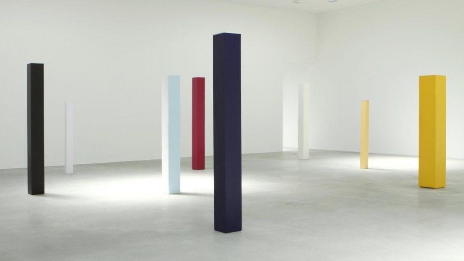 coloured columns standing in a gallery space