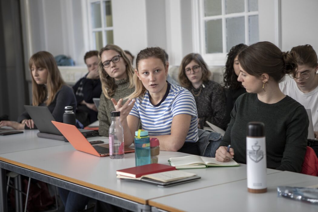 Student talking during a seminar.