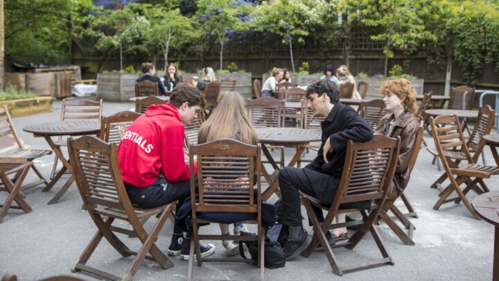 students sat outside vernon square