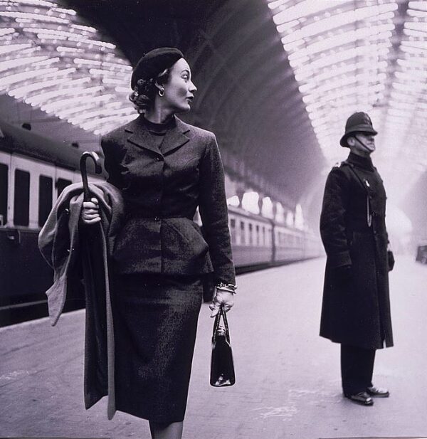 Fashion model Lisa Fonssagrives in Paddington station, London, by American photographer Toni Frissell (1907-1988). Color film copy transparency from black-and-white original. Originally published in Harper's Bazaar, 1951; re-published in Toni Frissell: Photographs, 1933-1967, New York, NY: Doubleday, 1994
