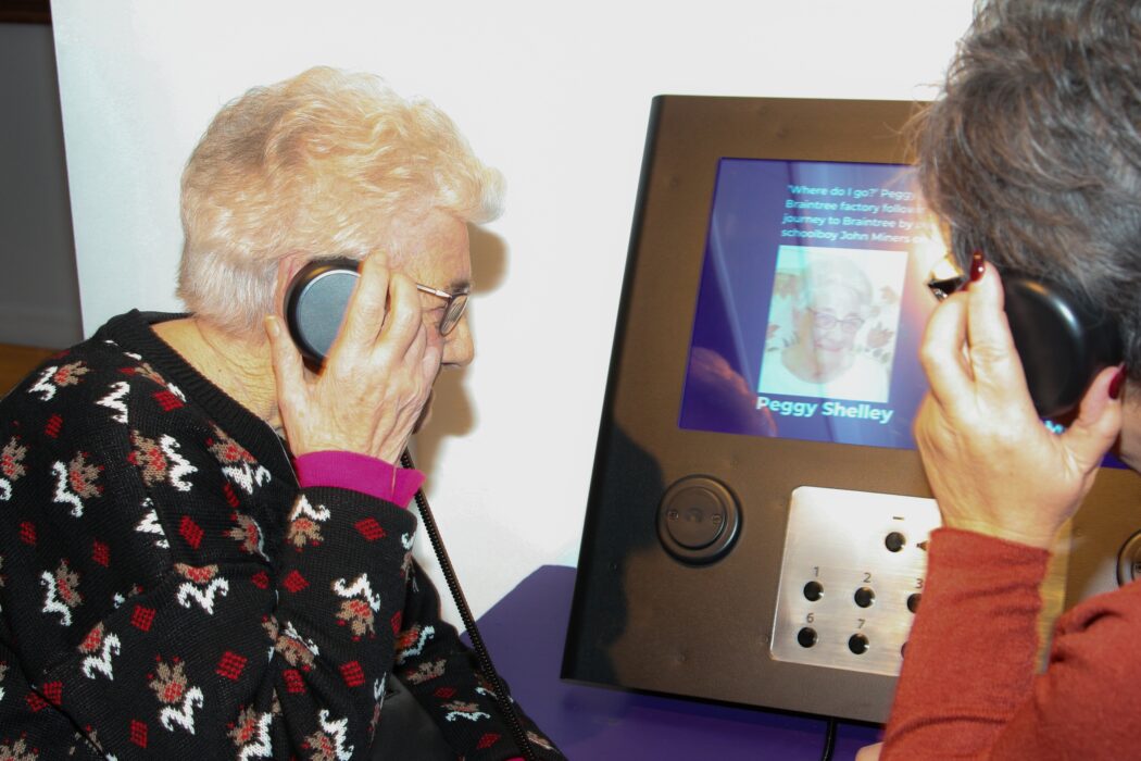Visitors Listening to Audio Stories