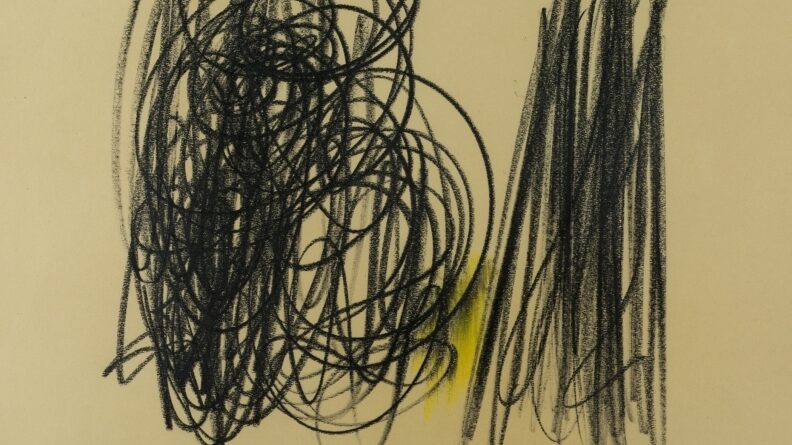Black charcoal drawing on yellow paper, with rough abstract pencil strokes. Two clear shapes are seen in the marks - on the left, more circular forms, and on the right, more controlled, linear, and vertical. A vivid yellow splash is visible behind the circular form.