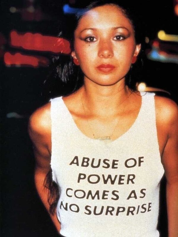 Jenny Holzer, Abuse of Power Comes As No Surprise (from the series Truisms), 1980. T-shirts, worn by Lady Pink © 1983 Lisa Kahane, NYC
