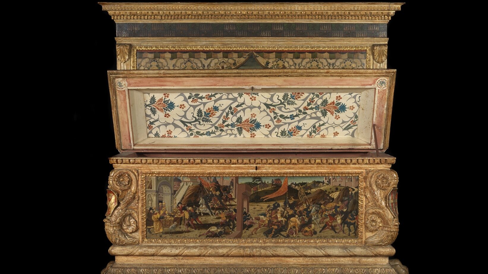 The Morelli-Nerli cassoni wedding chest includes intricate details such as coats of arms on the corners of each chest.