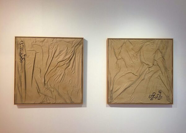 Two artworks hanging on a wall