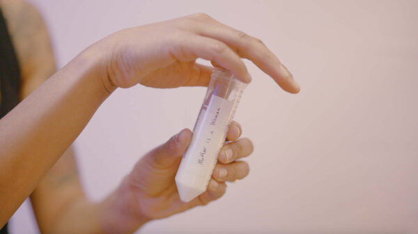 Photo of person holding a test tube