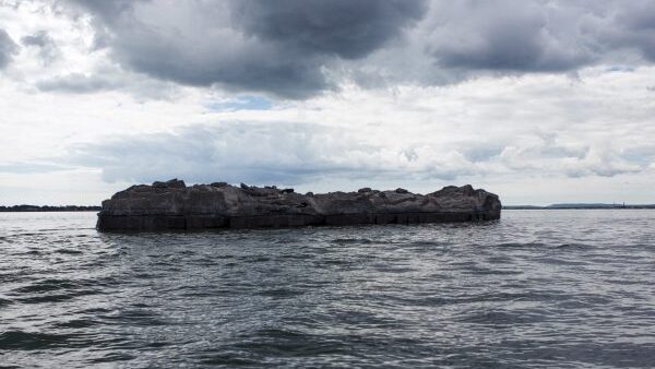 Photograph of a rock in the sea
