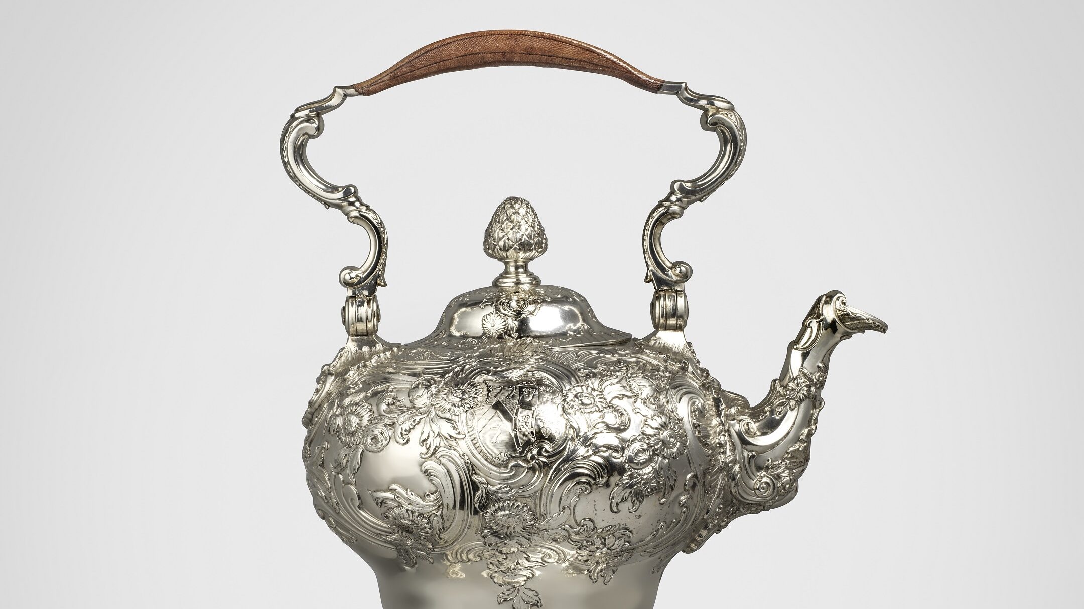 Ornate George II silver tea kettle with an ornate stand and handle