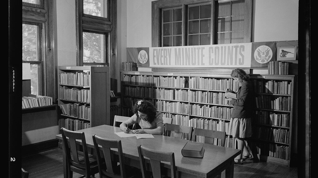 Photo of two women in a library