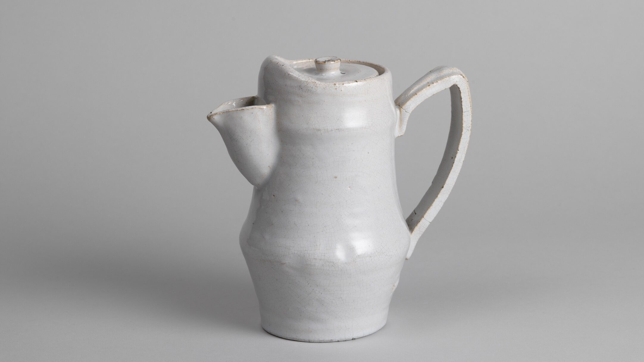 A white tin-glazed coffee pot from the Omega Workshop