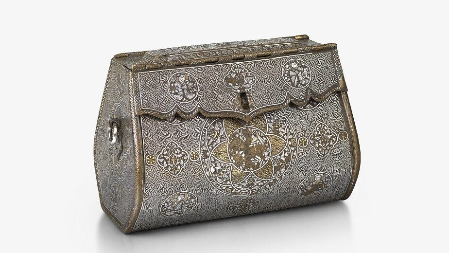 An intricate, oblong-shaped metal bag with front-closure. There are detailed illustrations at regular points across the front, and gold and silver inlays.