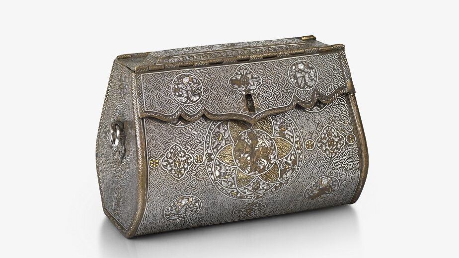 An intricate, oblong-shaped metal bag with front-closure. There are detailed illustrations at regular points across the front, and gold and silver inlays.