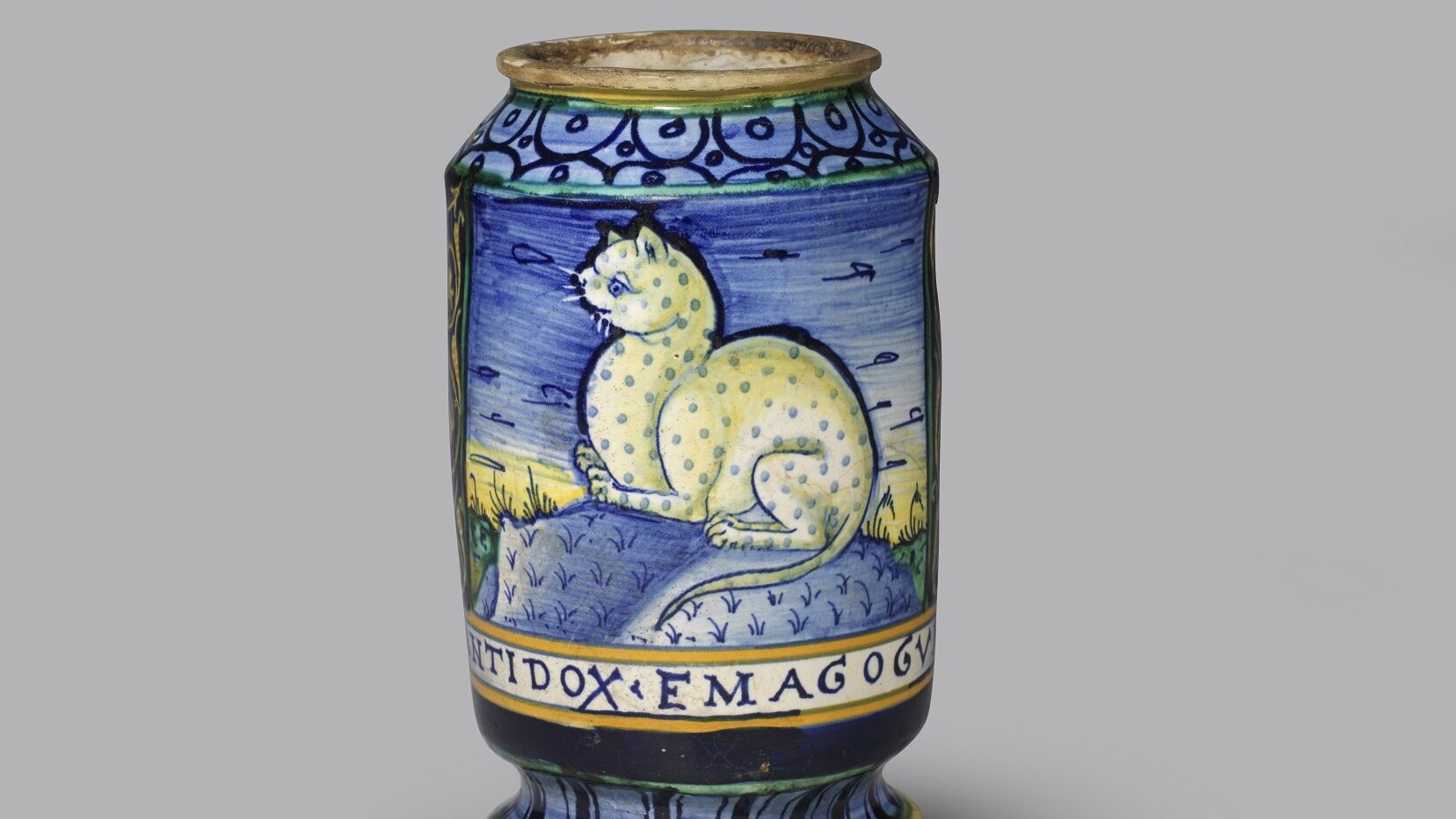 A blue drug jar or albarello decorated with a spotted cat