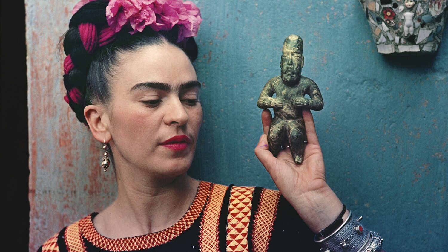 Frida Kahlo with Olmec figurine