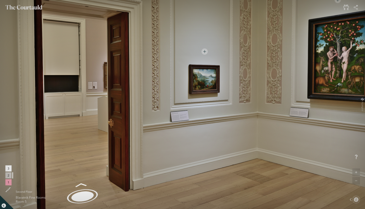 Photo of a wall hung with paintings