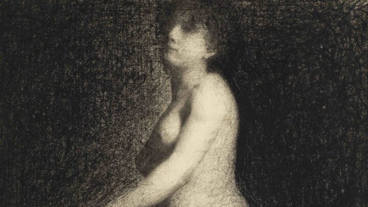 A drawing of a nude woman, seemingly kneeling on a chair, although the chair is not visible. The background is completely dark with the figure contrasting in light colours. Both legs and arms fade into the edges of the paper, and there are no harsh lines.