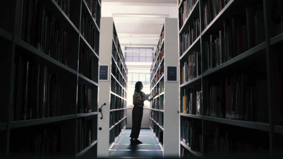 Staff collecting books in the library