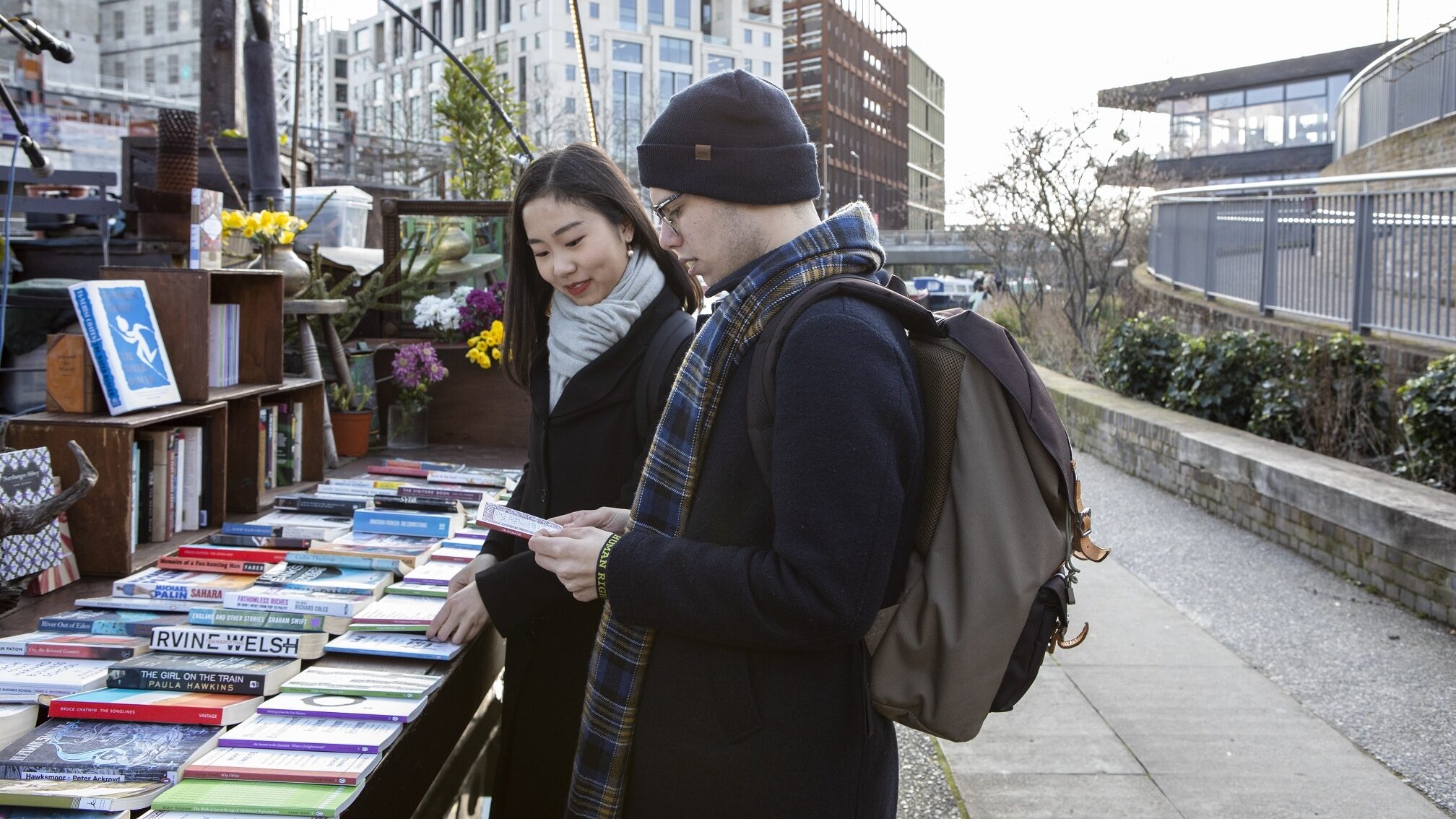 students reading books outside