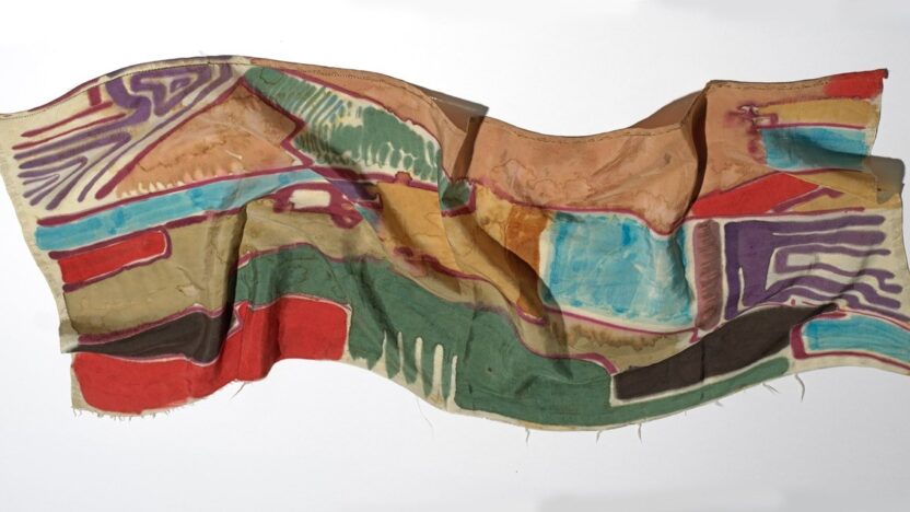 An image of a vibrant hand painted silk scarf, created by the artist Jock Turnbull