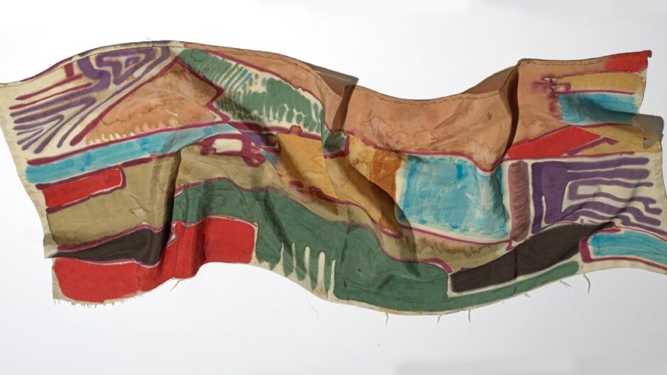 An image of a vibrant hand painted silk scarf, created by the artist Jock Turnbull
