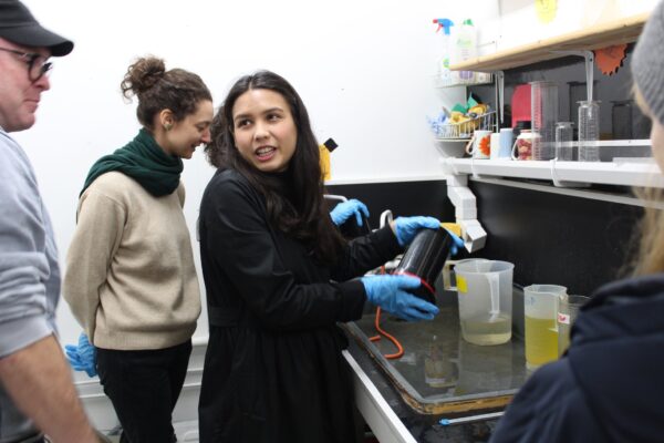 a group of students developing analogue film