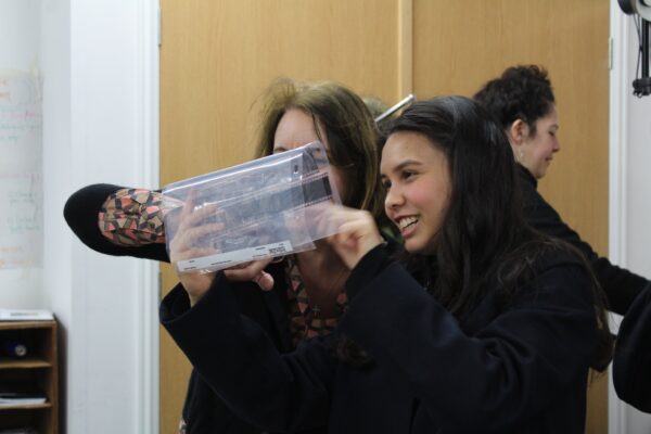 students looking a photo contact sheets