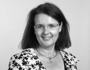 Greyscale photographic portrait of Charmian Caines