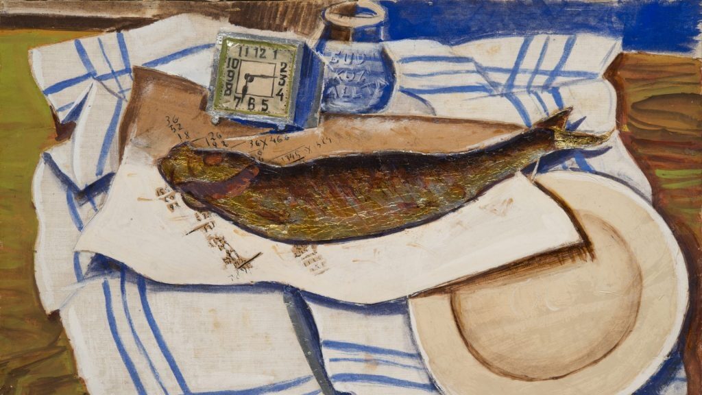 table with a blue and white tablecloth and a fish