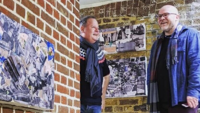 Two men, Tom Bilson from The Courtauld and David Anthony from beyondAutism, enjoying the exhibition, smiling together.