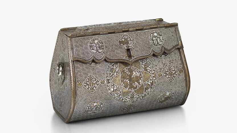An intricate, oblong-shaped metal bag with front-closure. There are detailed illustrations at regular points across the front, and gold and silver inlays.
