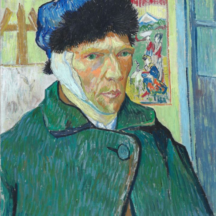A self-portrait of Van Gogh wearing a green coat, a blue hat with a black trim, and a bandaged left ear. A Japanese print and an easel can be seen behind him.