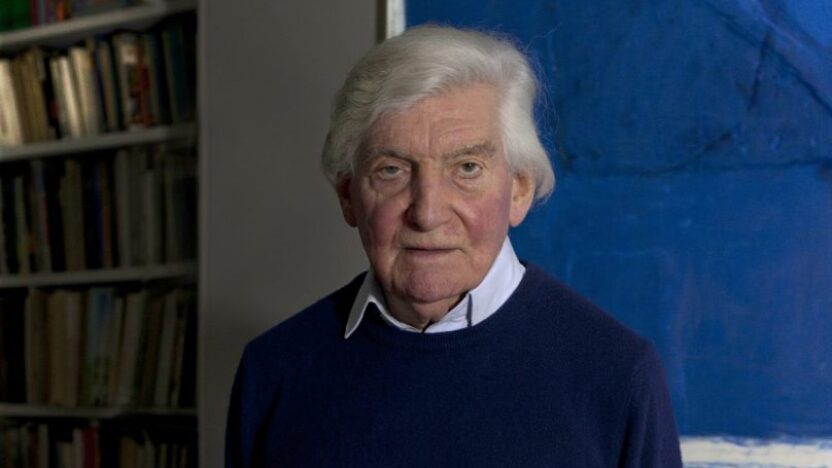 Sir Alan Bowness portrait against a blue background