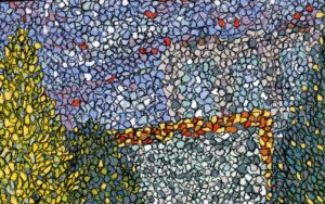 completed example of a confetti landscape. pieces of paper have been cut out into small sections and built up to create a colourful landscape which mimics the pointilist style