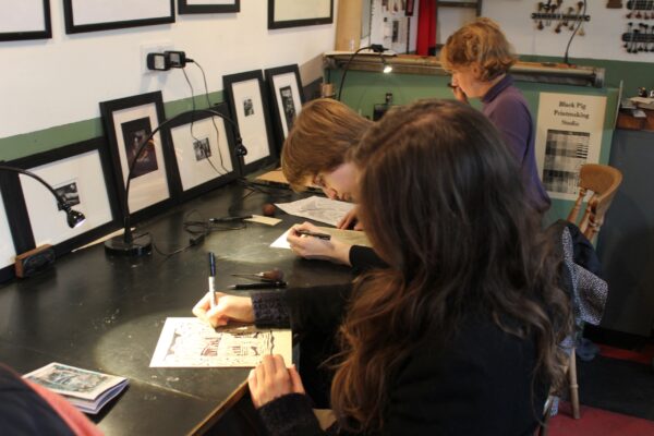 students in a lino cut workshop