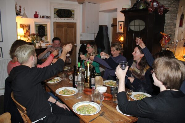 a material witness group photo at dinner during Chris Pig studio residential