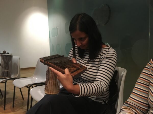 a student examines a musical instrument at The Horniman Museum