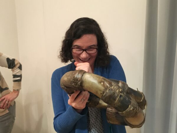 a student examines a musical instrument at The Horniman Museum