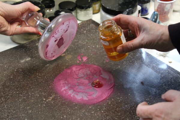adding oil to a pigment to make paint