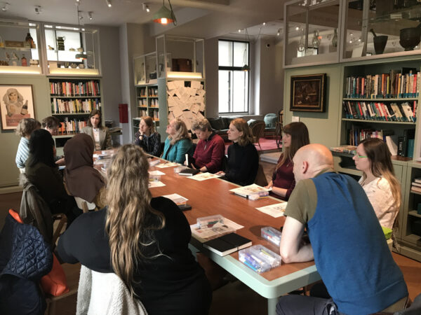 a group of students sitting around a table