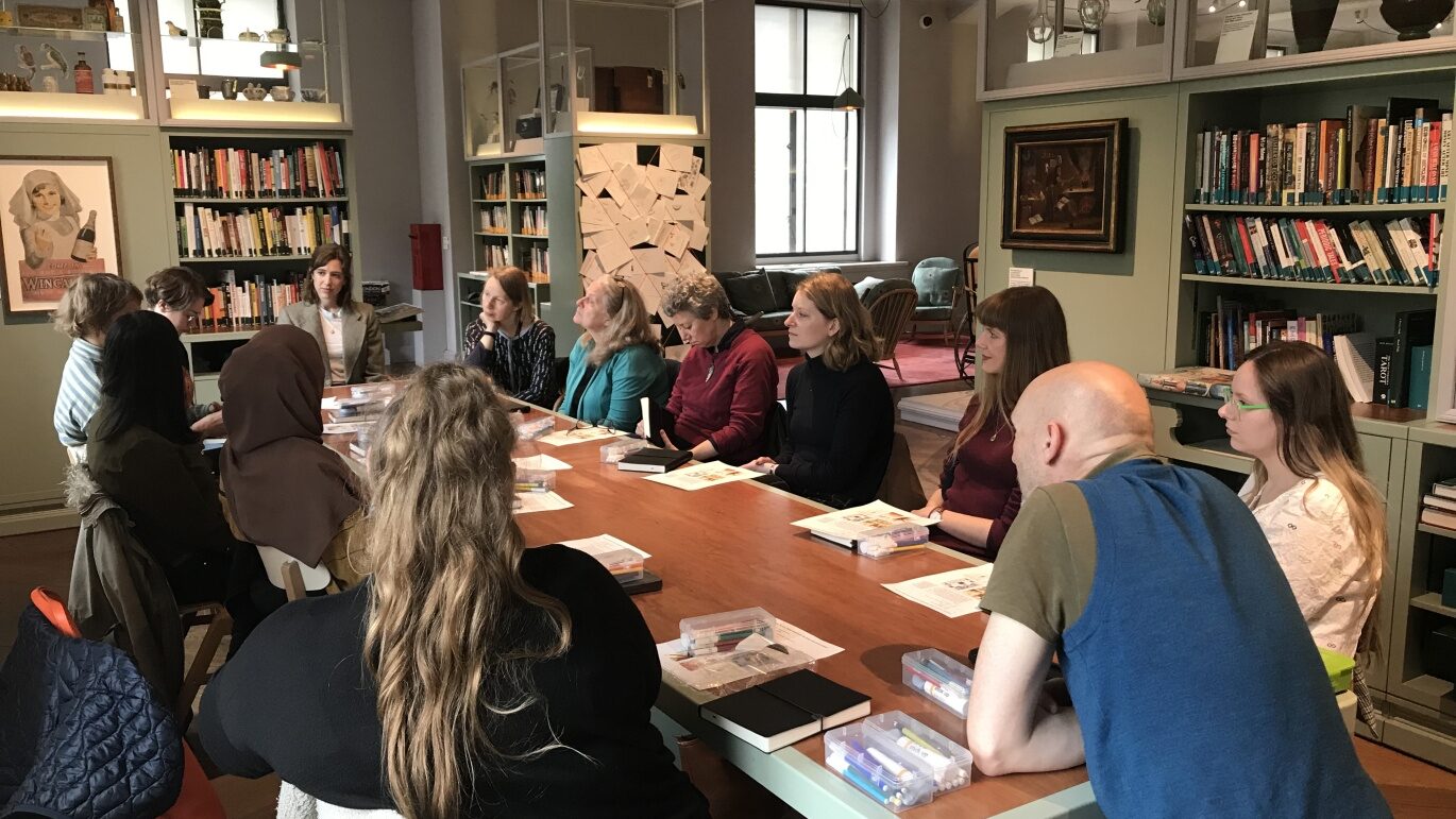 a group of students sitting around a table