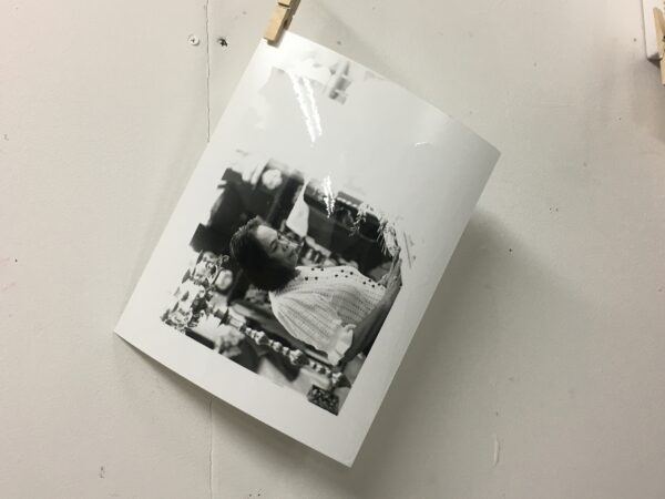 a photograph hanging out to dry after being developed.