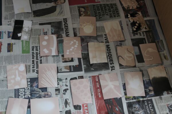 chemigrams drying on newsprint