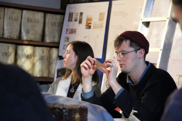 a student looking at samples of velum