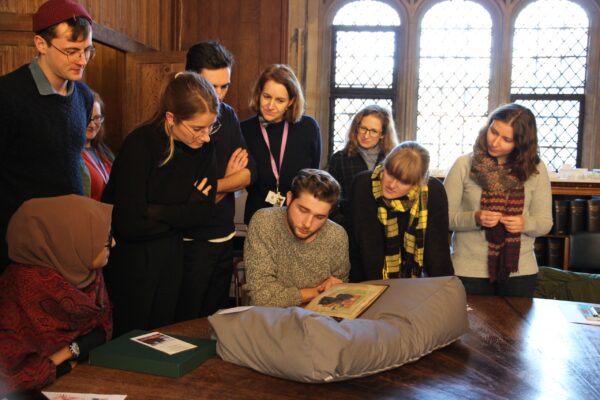 students viewing The Lambeth Apocalypse (MS 209) at Lambeth Palace Library