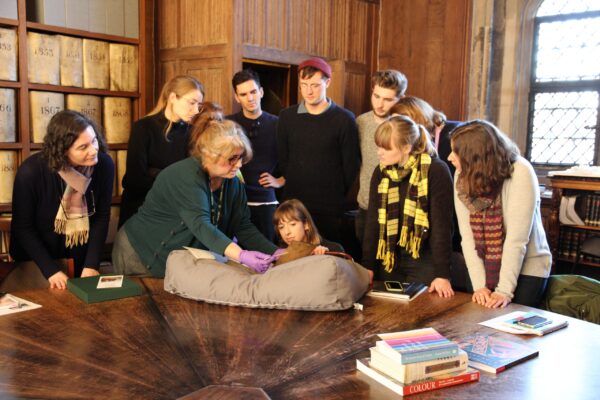students viewing The Lambeth Apocalypse (MS 209) at Lambeth Palace Library