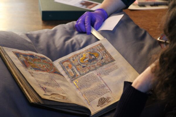 students viewing The Lambeth Apocalypse (MS 209) at Lambeth Palace Library