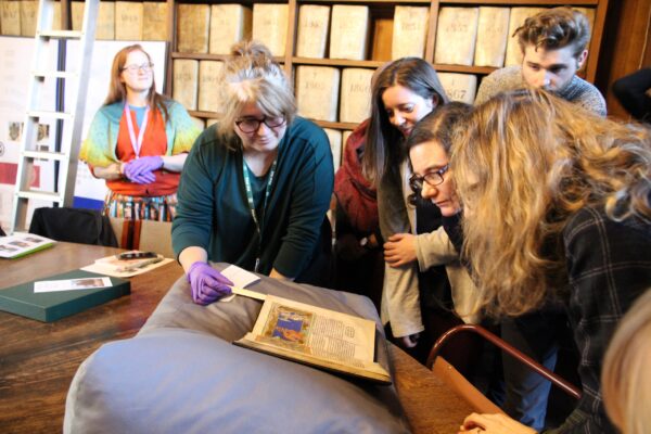 students viewing The Lambeth Apocalypse (MS 209) at Lambeth Palace Library