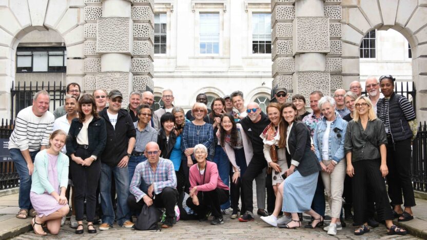 group of volunteers stood together infront of the courtauld at somerset house