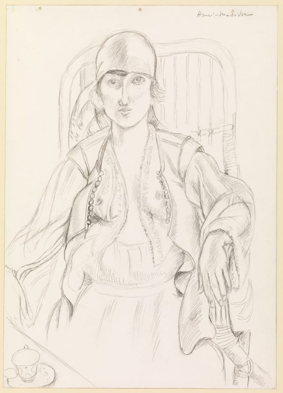 A drawing of a seated woman by Henri Matisse. Her frank, challenging expression combine with her soft contours and the sinuous lines of her revealing clothes