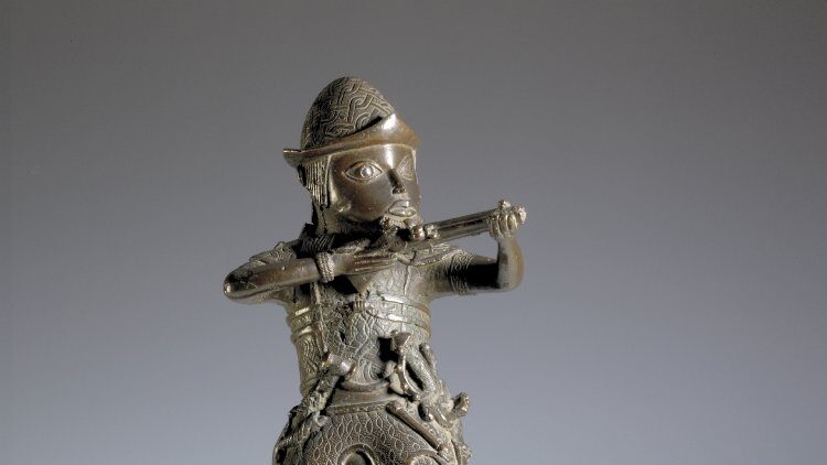 Brass figure of a Portuguese soldier holding a musket